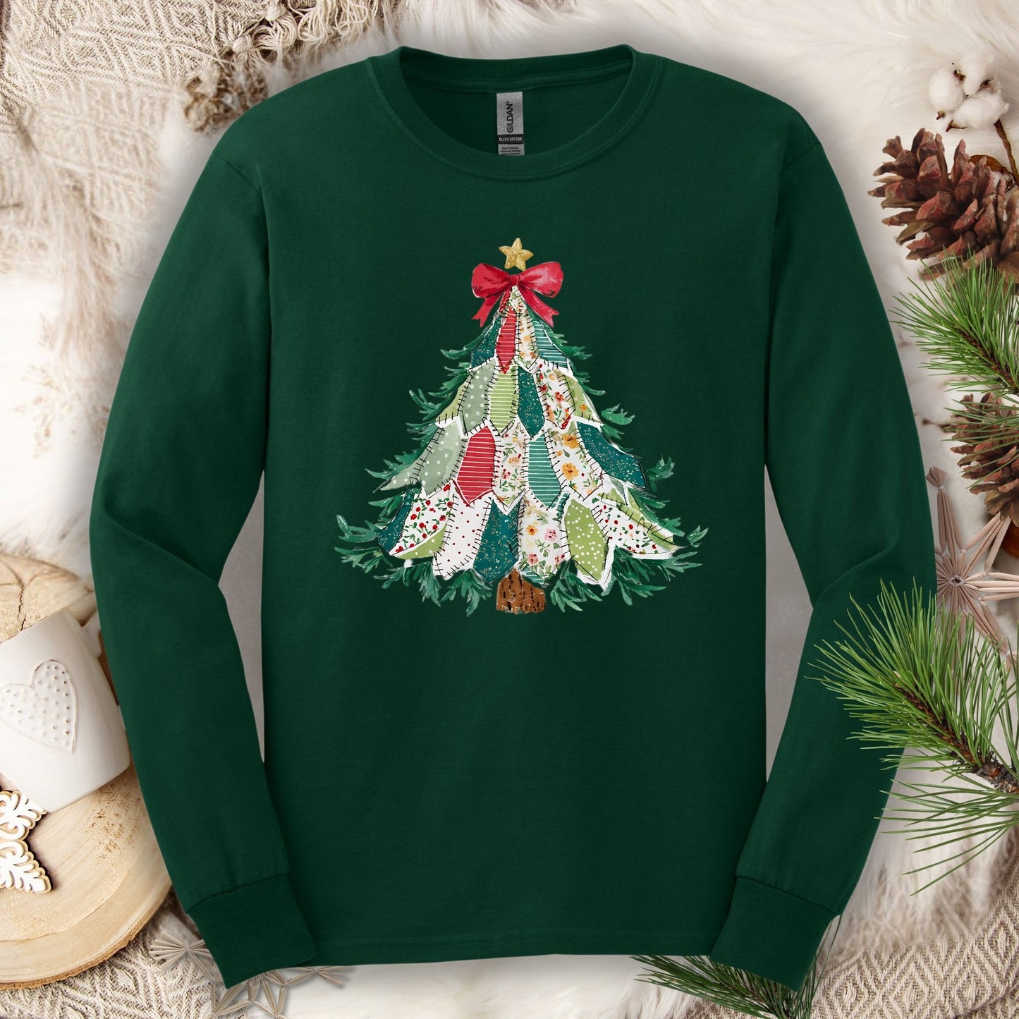 Forest green long sleeve tee with a printed country-style quilted Christmas tree design.
