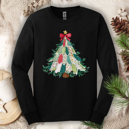 Black long sleeve tee with a printed country-style quilted Christmas tree design, red bow, and gold star.