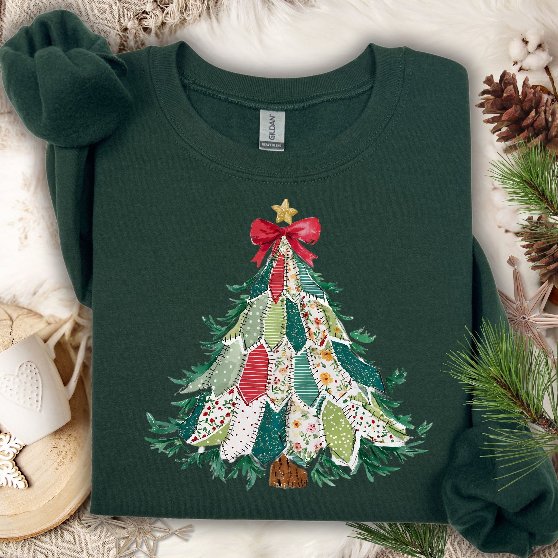 Forest Green Gildan sweatshirt with a printed country-style patchwork Christmas tree design, featuring rustic patterns and a red bow.