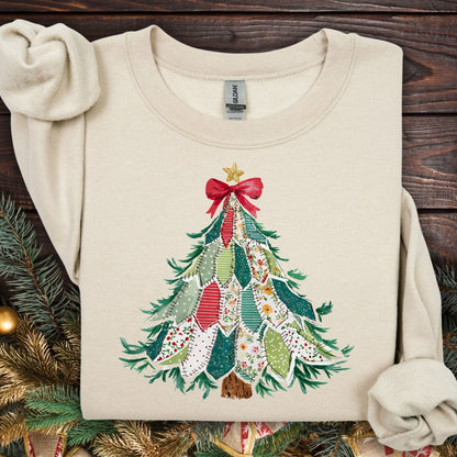 Sand Gildan sweatshirt with a printed country patchwork Christmas tree design and red bow.