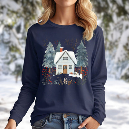 Navy long sleeve tee with a hand-drawn winter cabin and pine trees design, worn by a blonde woman.