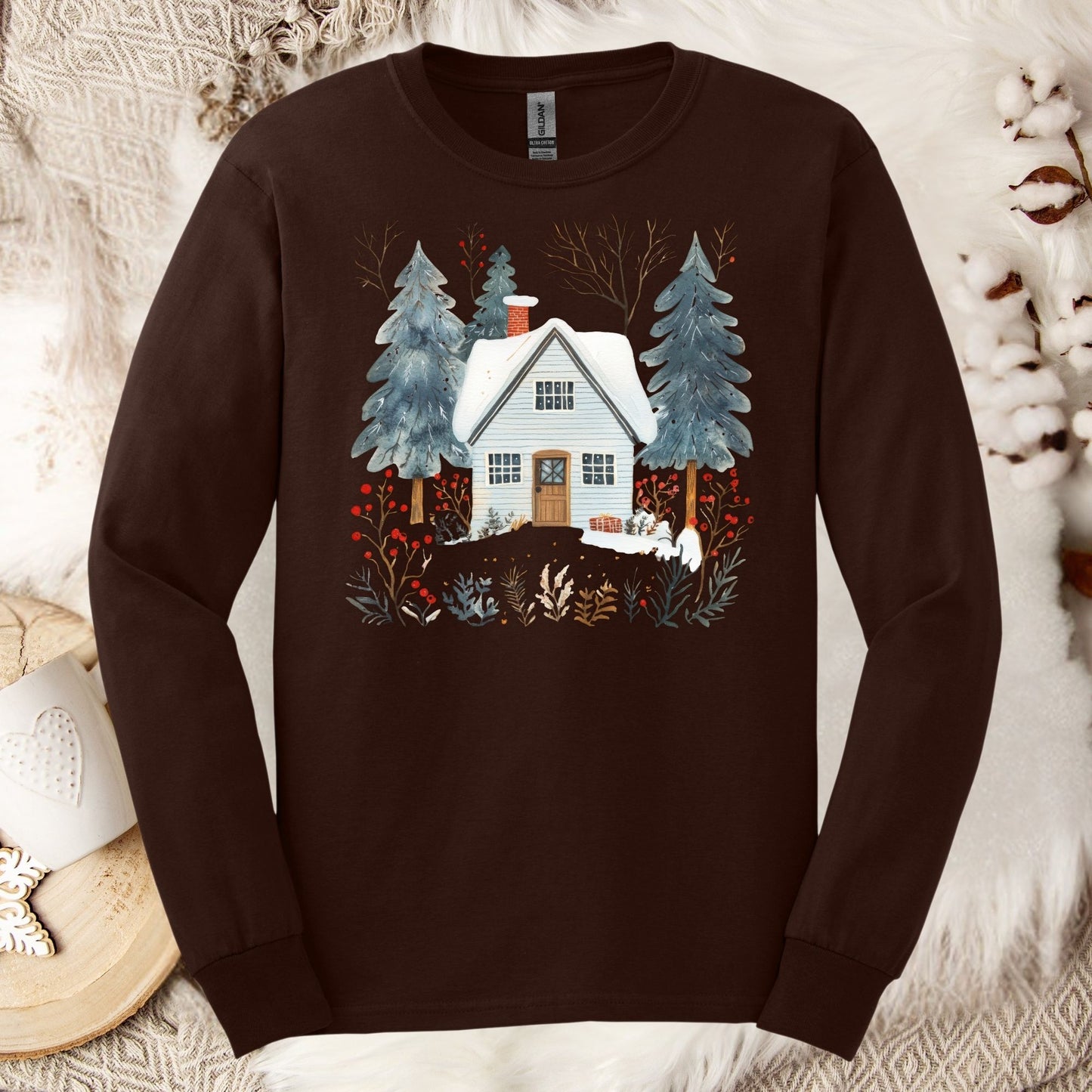 Dark chocolate long sleeve tee with a vintage-feel Nordic winter cabin and pine tree graphic, size S.