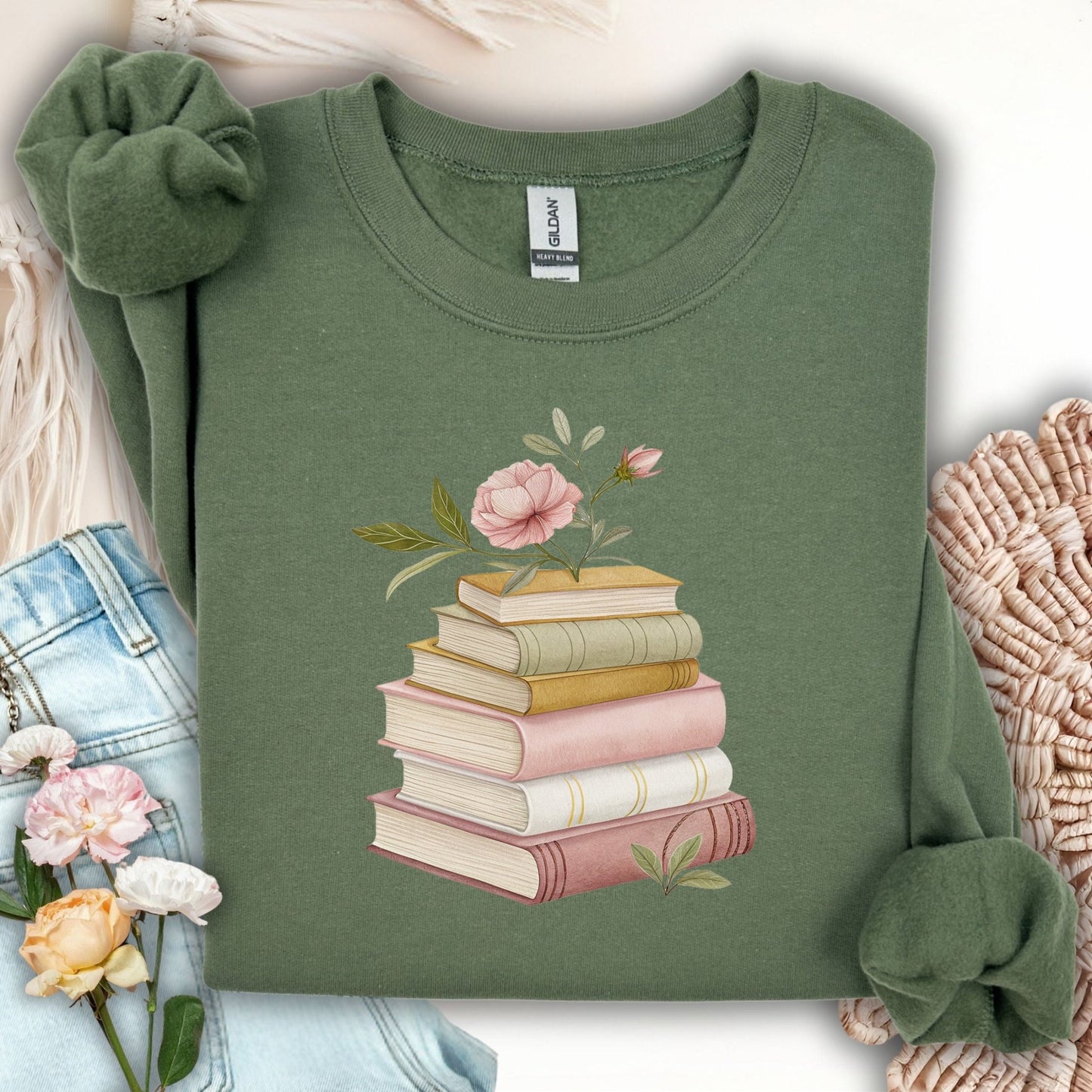 Military Green S sweatshirt with botanical art of stacked books and pink flowers.