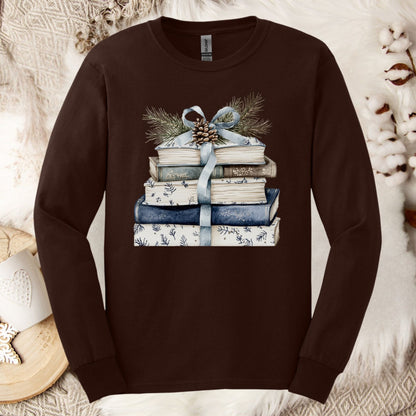 Dark Chocolate long sleeve tee with stacked blue and white books, blue ribbon, evergreen, and pinecone graphic.