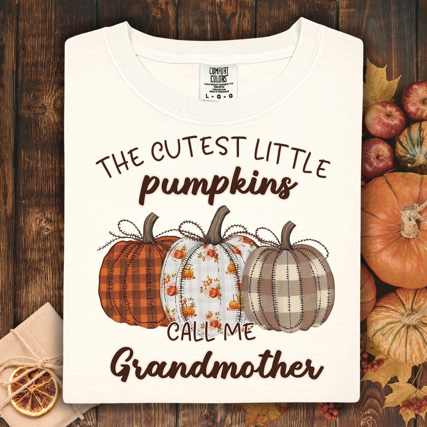 Ivory Comfort Colors® t-shirt with "The Cutest Little Pumpkins Call Me Grandmother" and three patterned pumpkins.