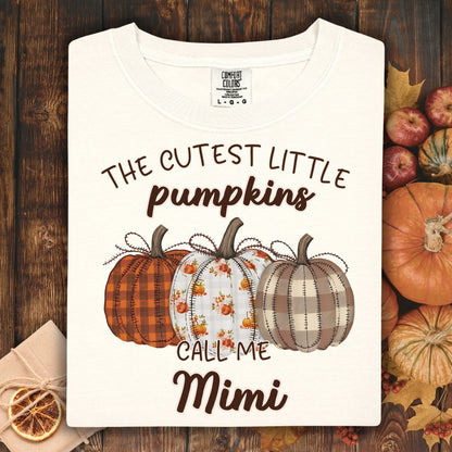 Ivory Comfort Colors t-shirt with "The Cutest Little Pumpkins Call Me Mimi" and three autumn pumpkins.