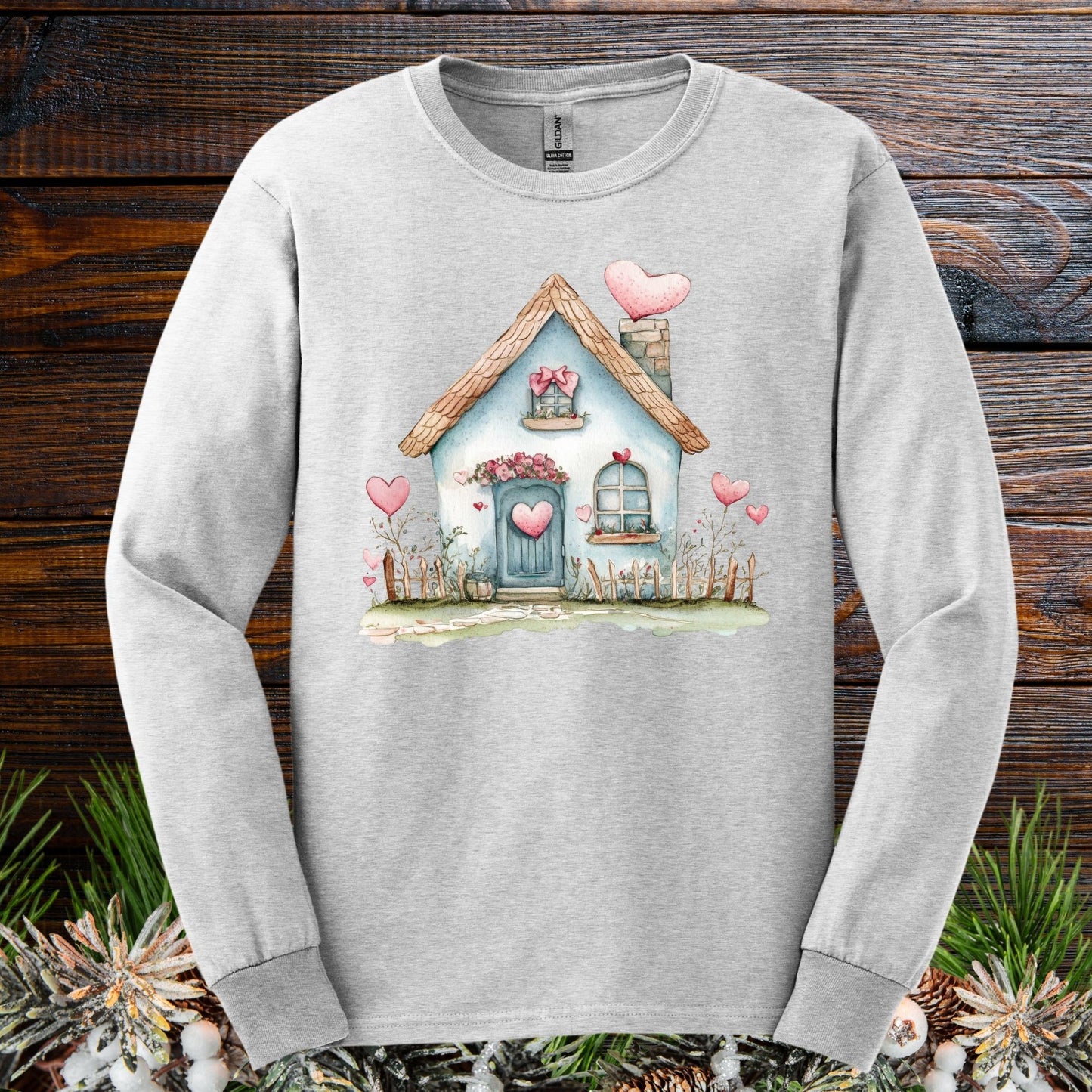 Ash long sleeve tee with a watercolor blue Valentine's cottage and pink hearts design.