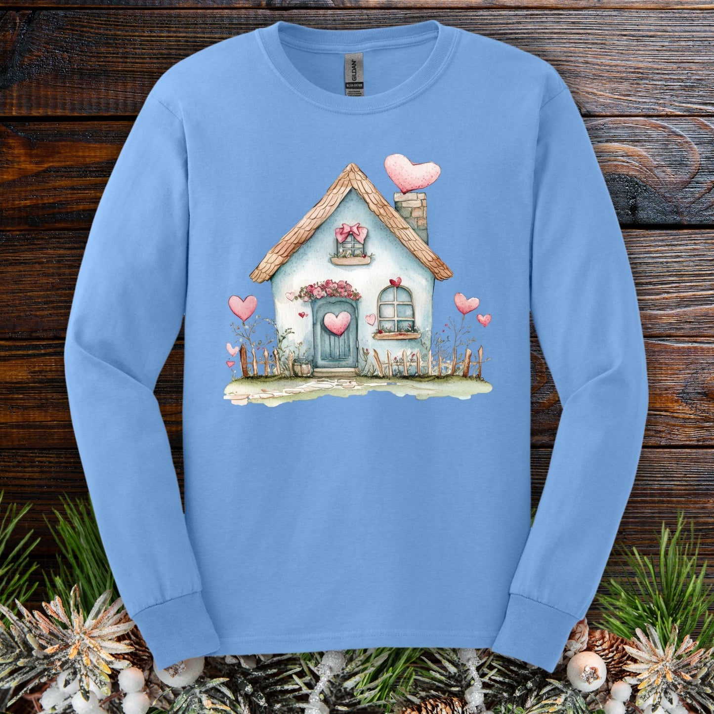 Carolina Blue long sleeve tee with a watercolor blue cottage and pink hearts design.