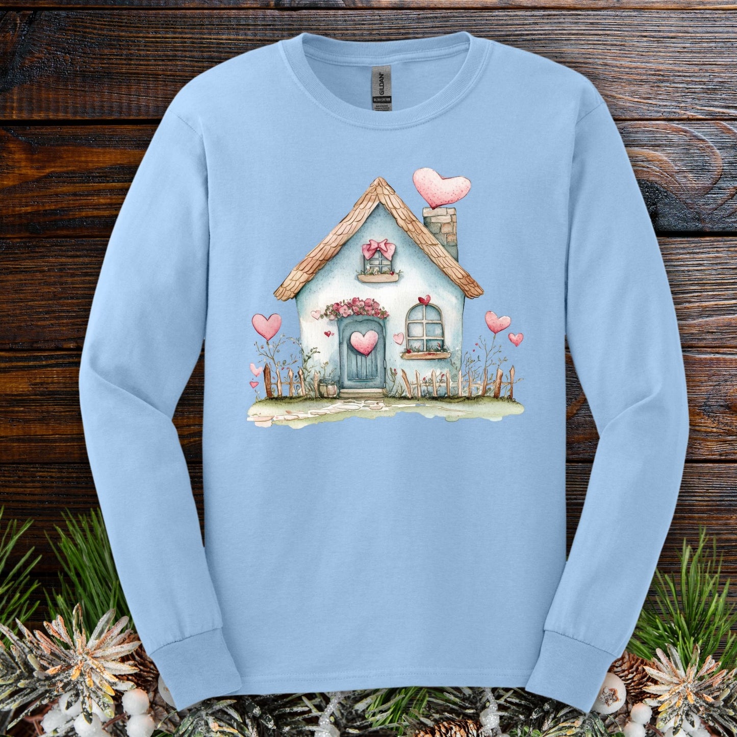 Light blue long sleeve tee with watercolor blue cottage and pink hearts design.