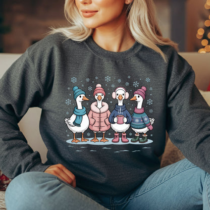 Dark gray heavy blend sweatshirt with four cartoon geese in winter clothes, drinking hot chocolate in snow.