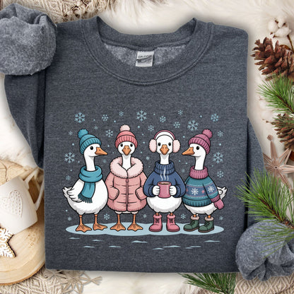 Dark Heather S sweatshirt with four cute geese in winter sweaters, hats, and mittens, drinking hot chocolate.