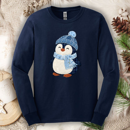 Navy long sleeve tee with a cute faux patchwork winter penguin in a blue hat and scarf.