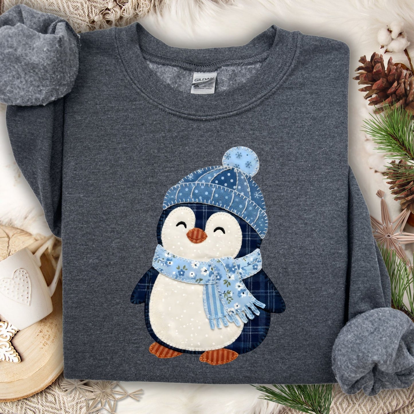 Dark Heather S sweatshirt with a cute faux patchwork penguin wearing a blue hat and scarf.