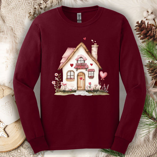 Maroon long sleeve tee with a watercolor beige cottage, pink hearts, and shutters design.