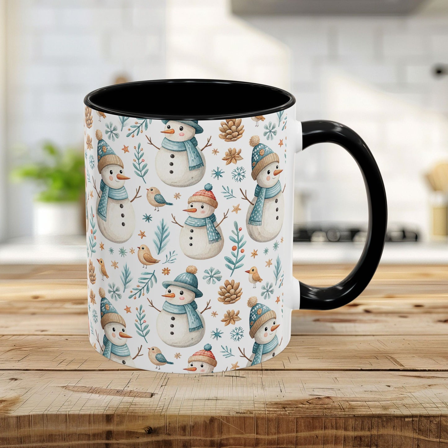 11oz ceramic mug with watercolor snowmen, birds, pinecones, and winter foliage on white, black interior and handle.