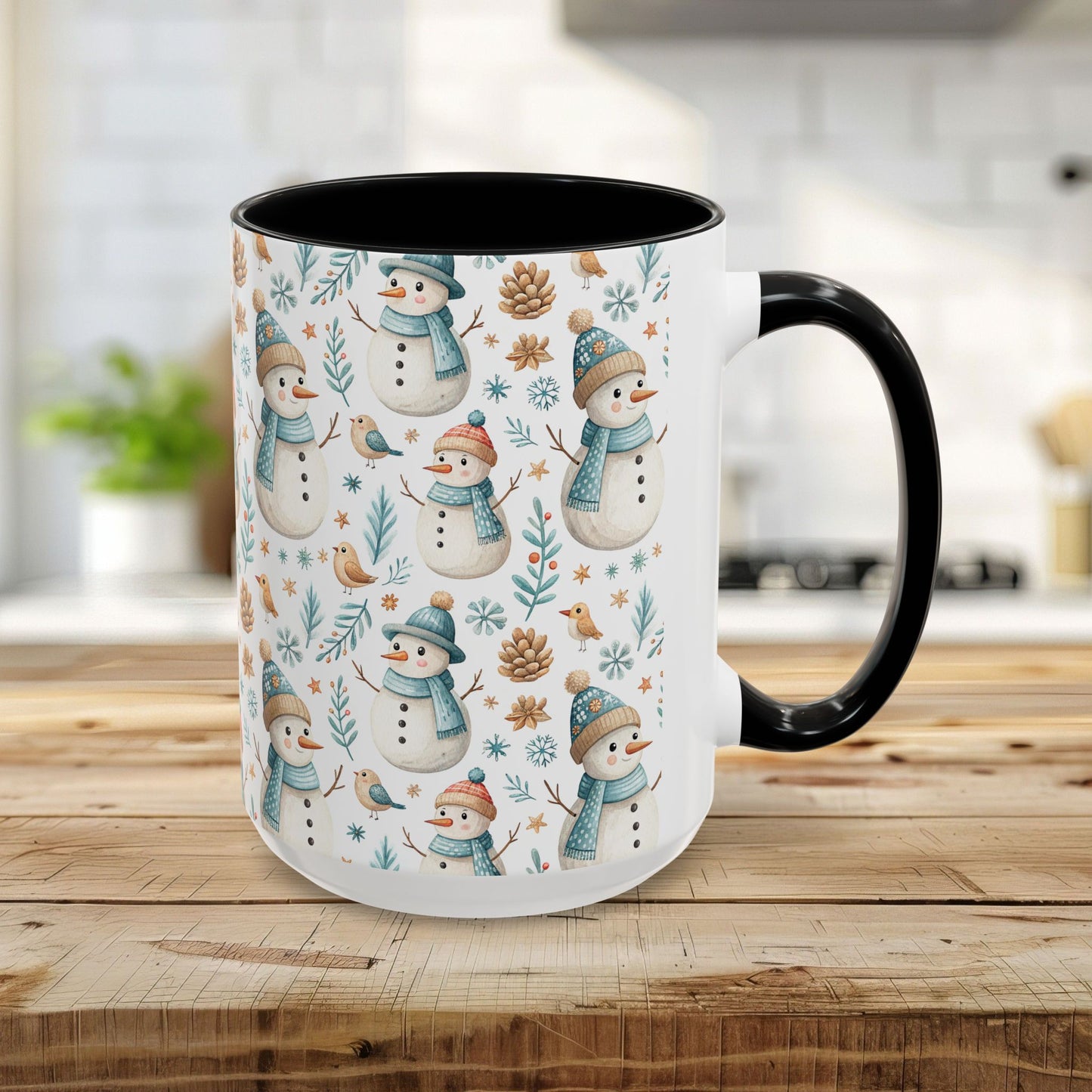 15oz ceramic mug with watercolor snowmen, birds, and pinecones on white, black interior and handle.