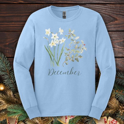 Light blue long-sleeve tee with watercolor narcissus, holly, and "December" text.