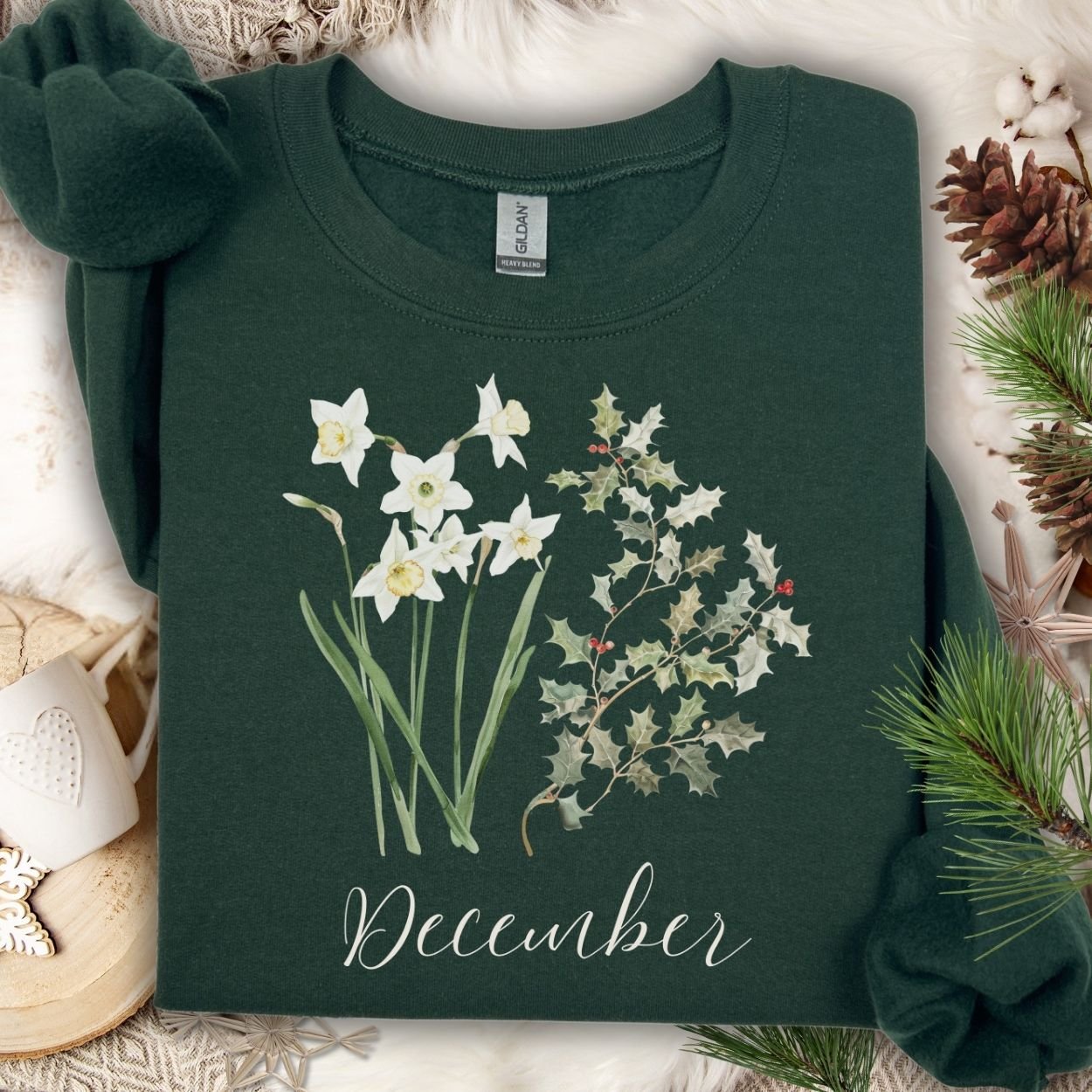 Forest Green unisex sweatshirt with watercolor narcissus, holly, and "December" text.
