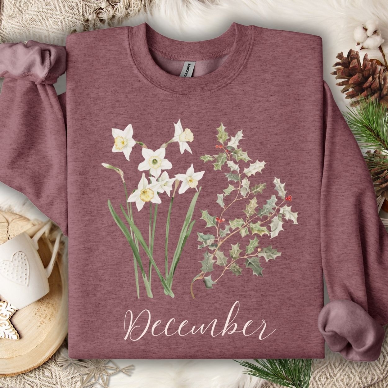 Heather Sport Dark Navy unisex sweatshirt with watercolor narcissus, holly, and "December" text.