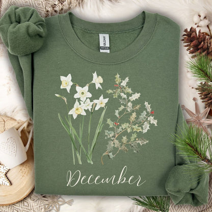 Military Green unisex sweatshirt with watercolor narcissus, holly, and "December" text.