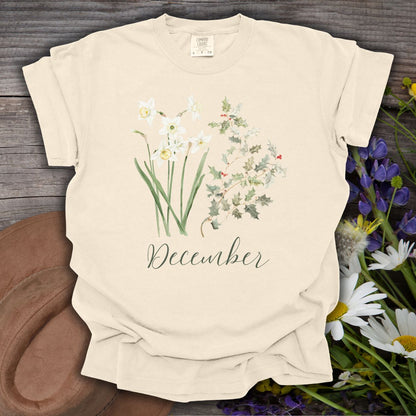 Ivory S t-shirt with watercolor narcissus, holly berry, and "December" script.