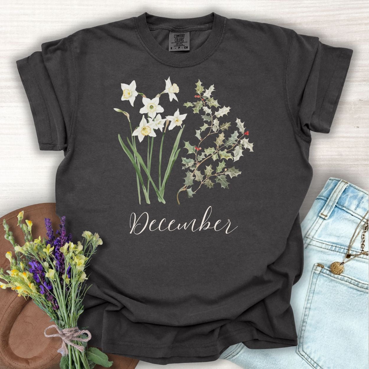 Pepper S t-shirt with watercolor narcissus, holly, and "December" text.