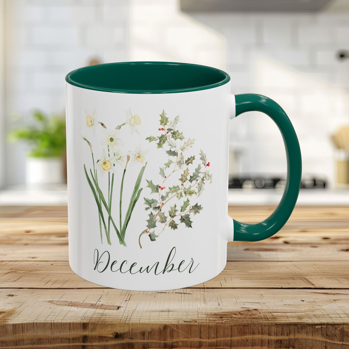 White 11oz mug with green handle and interior, featuring watercolor narcissus and holly berry, "December" script.