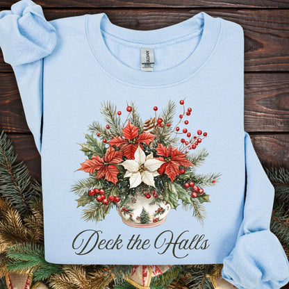 Light blue Gildan sweatshirt with a watercolor poinsettia bouquet in a vase and "Deck the Halls" text.
