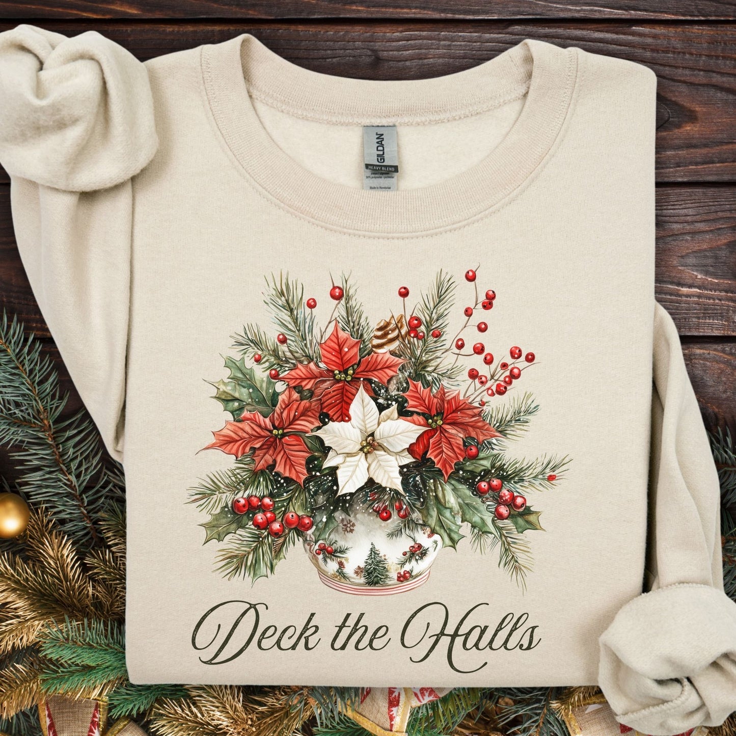 Sand Gildan sweatshirt with elegant watercolor poinsettia bouquet in a vase and "Deck the Halls" text.