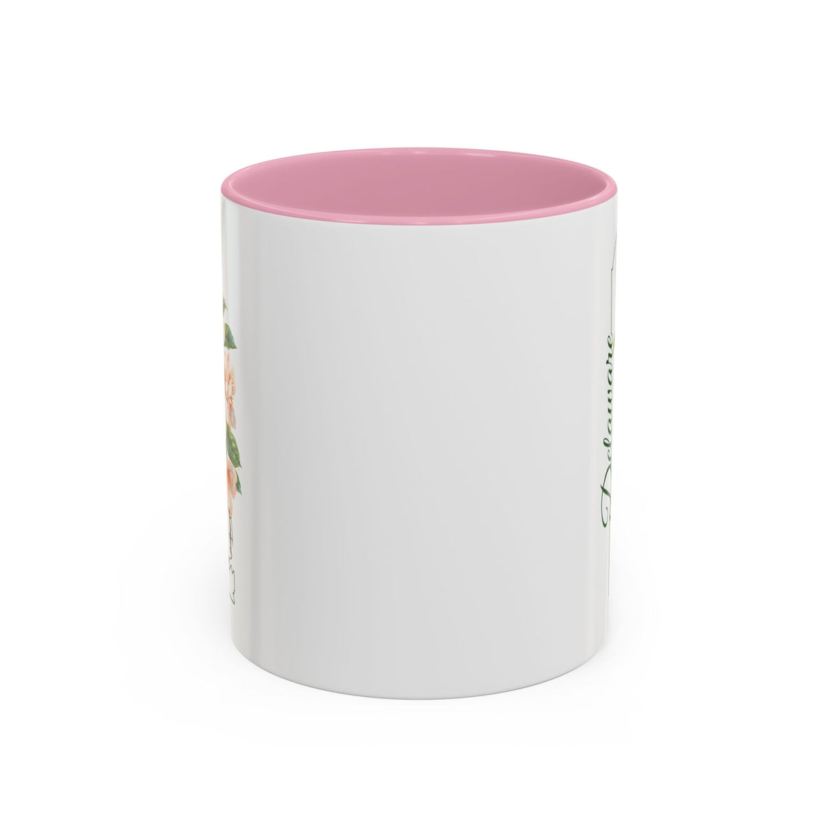 White ceramic mug with pink interior and handle, featuring a watercolor peach blossom design and "Delaware" text.