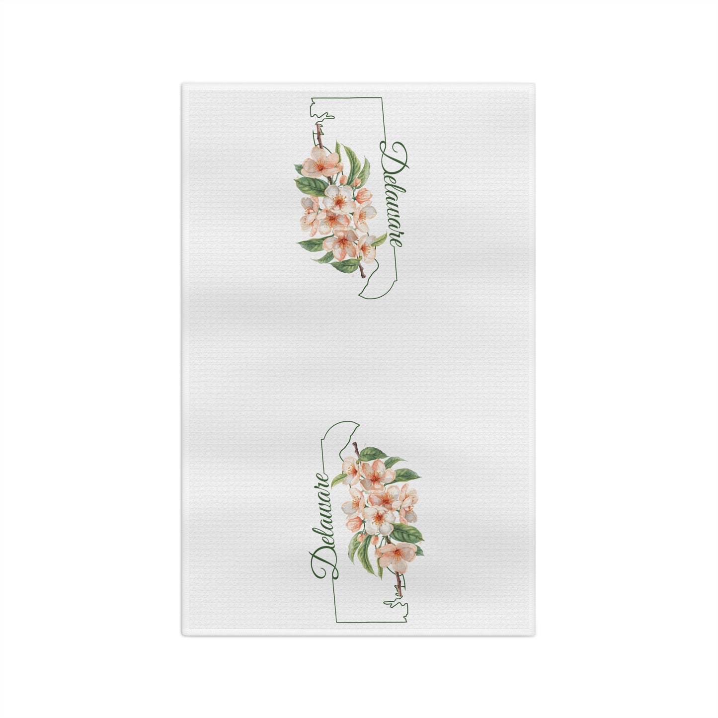 White microfiber tea towel with two Delaware state silhouettes, each adorned with delicate peach blossoms.