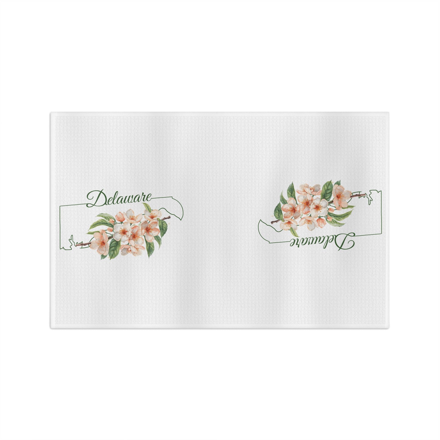 White microfiber tea towel with peach blossoms and "Delaware" text within a state silhouette.