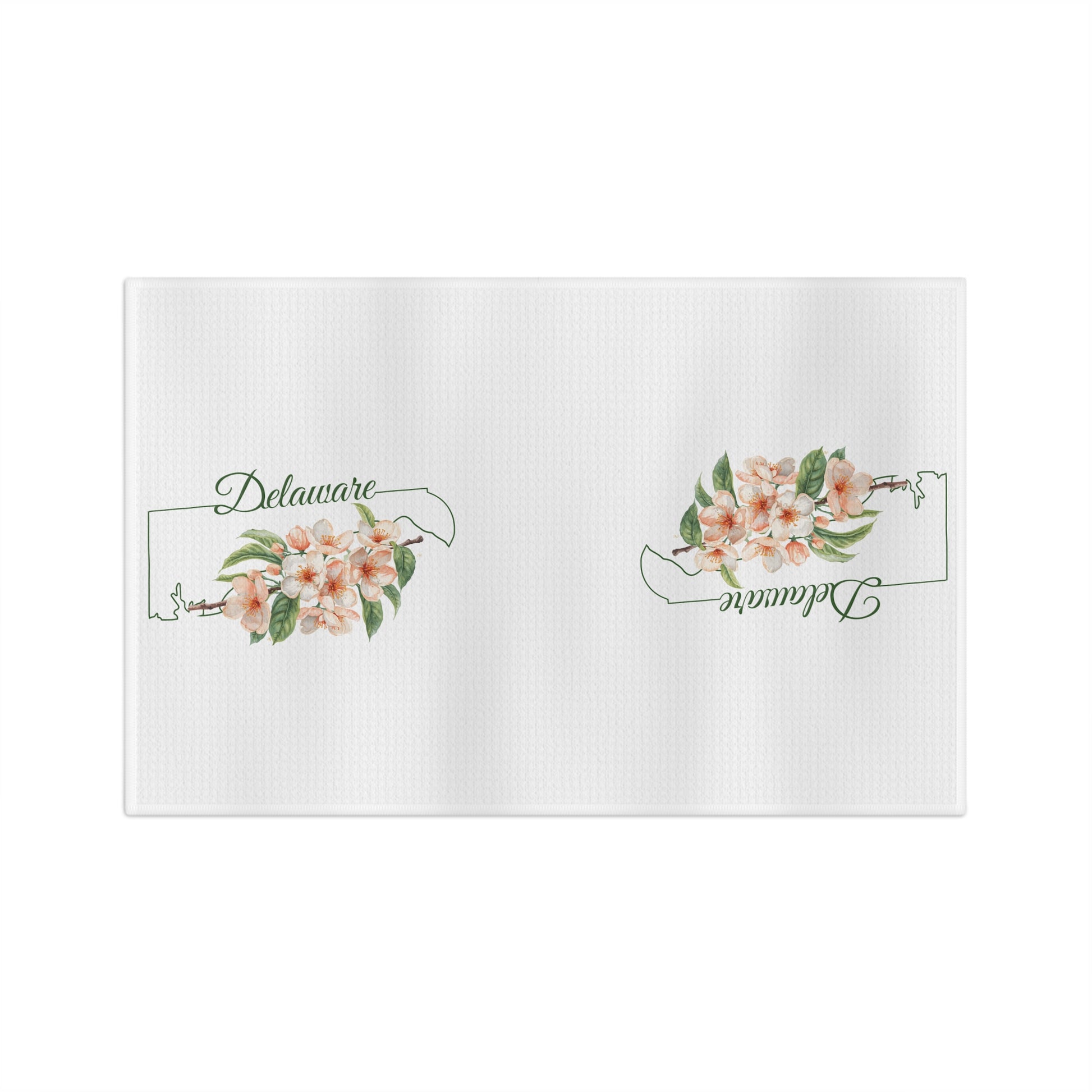 White microfiber tea towel with peach blossoms and "Delaware" text within a state silhouette.