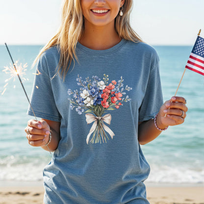 Garment-dyed blue t-shirt with a patriotic red, white, and blue floral bouquet design.