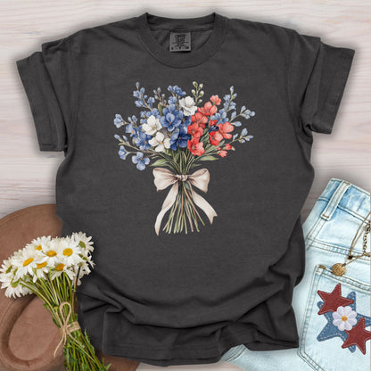 Pepper S t-shirt with a delicate patriotic bouquet of red, white, and blue flowers tied with a ribbon.