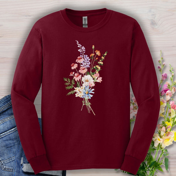 Maroon long-sleeve tee with a delicate watercolor wildflower bouquet on vintage-feel USA-grown cotton.