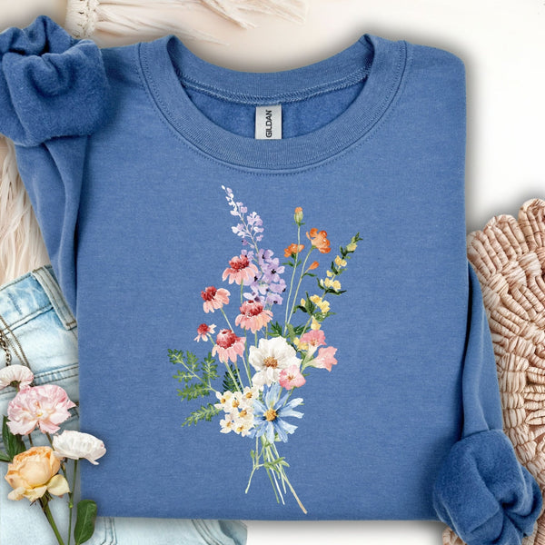 Indigo blue unisex sweatshirt with a delicate, hand-tied wildflower bouquet design at the center chest.