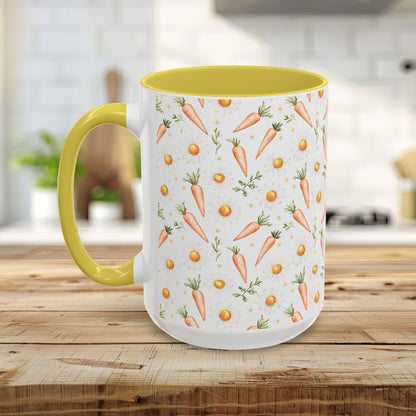 White ceramic mug with watercolor carrot and daisy pattern, yellow interior and C-handle.