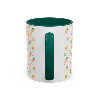White ceramic mug with watercolor carrots and daisies, green interior and handle.