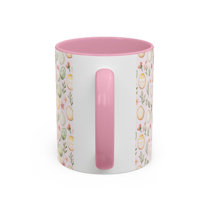 Easter pastel egg pattern mug with pink handle and interior, featuring watercolor eggs and sprigs.