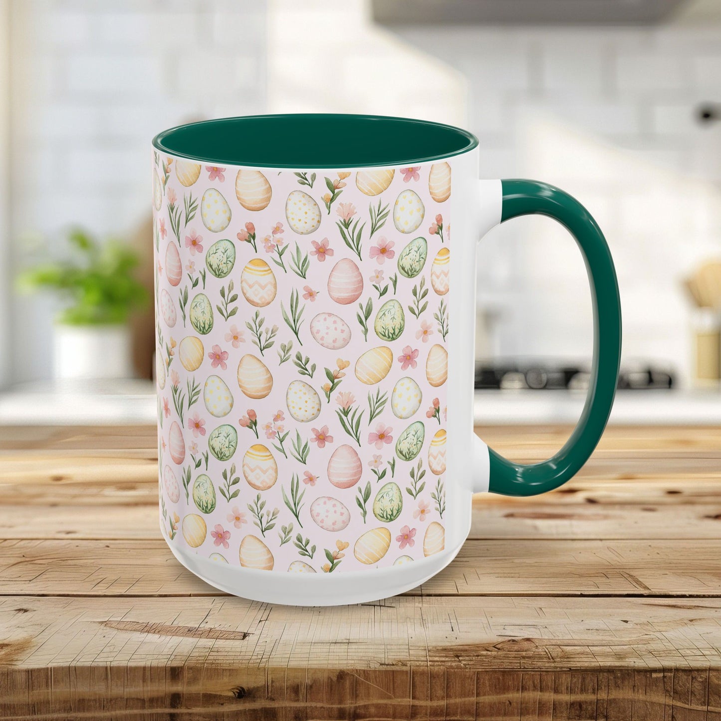 15oz ceramic mug with a green handle/interior and pastel watercolor Easter egg pattern.