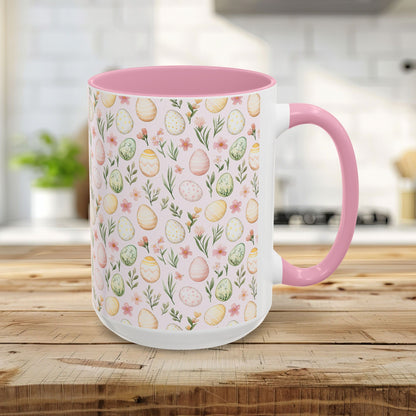 15oz ceramic mug with a pink interior/handle and a pastel watercolor Easter egg pattern.