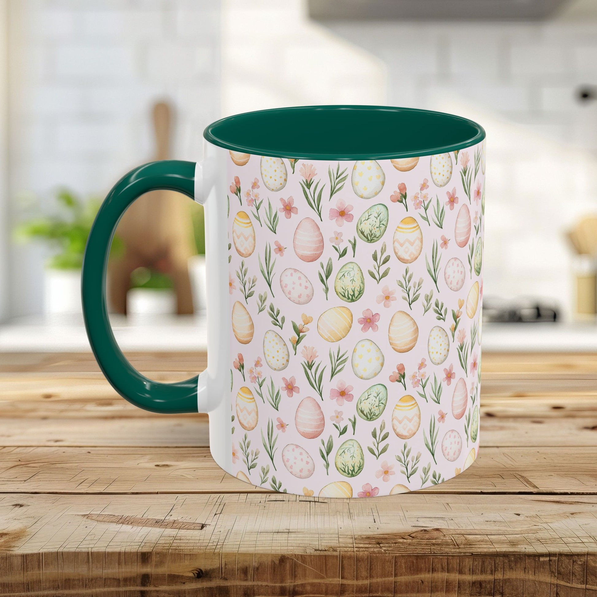 White ceramic mug with green handle and interior, featuring a pastel watercolor Easter egg and floral pattern.