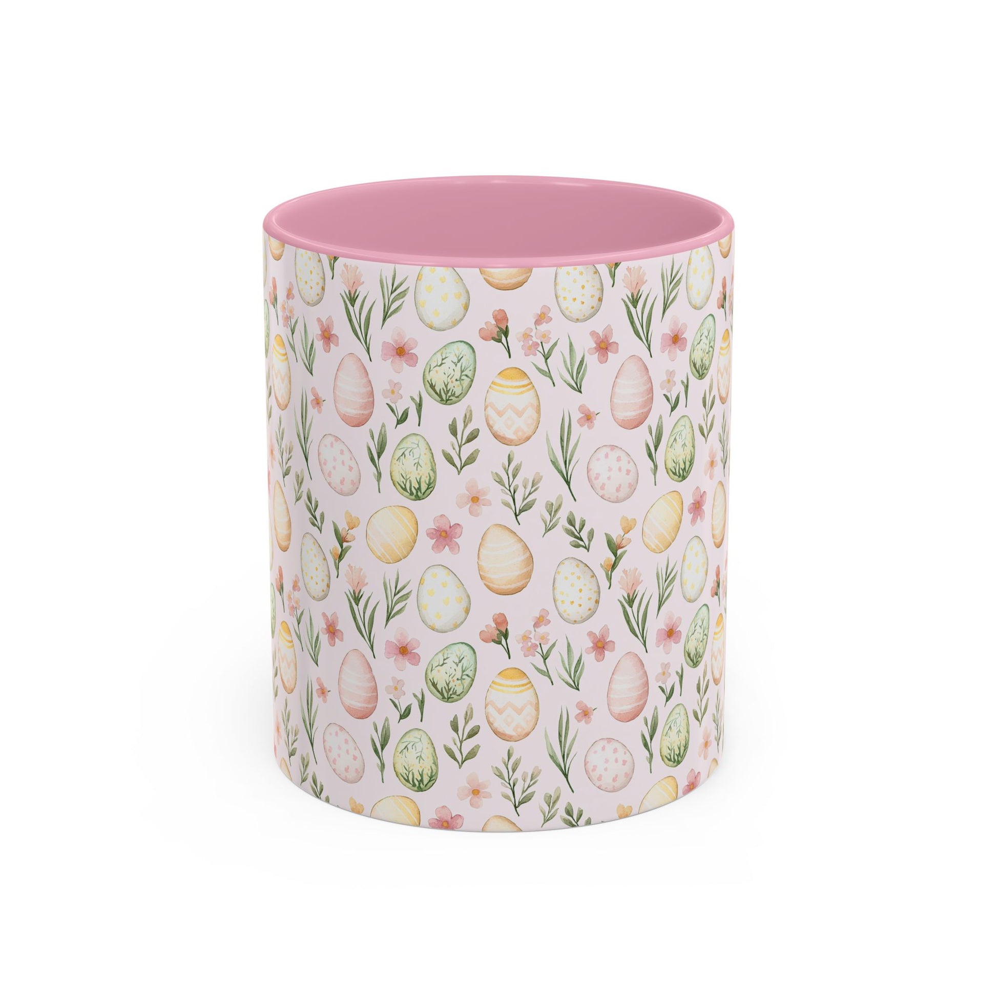 Ceramic mug with a pink interior, featuring a pastel watercolor Easter egg and floral pattern.