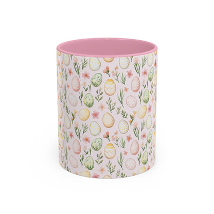 Ceramic mug with a pink interior, featuring a pastel watercolor Easter egg and floral pattern.