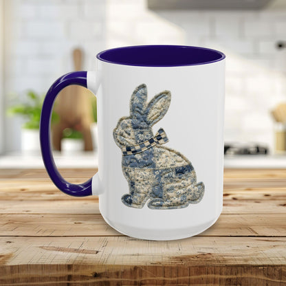 White ceramic 15oz mug with a purple handle and interior, featuring a blue patchwork bunny design.