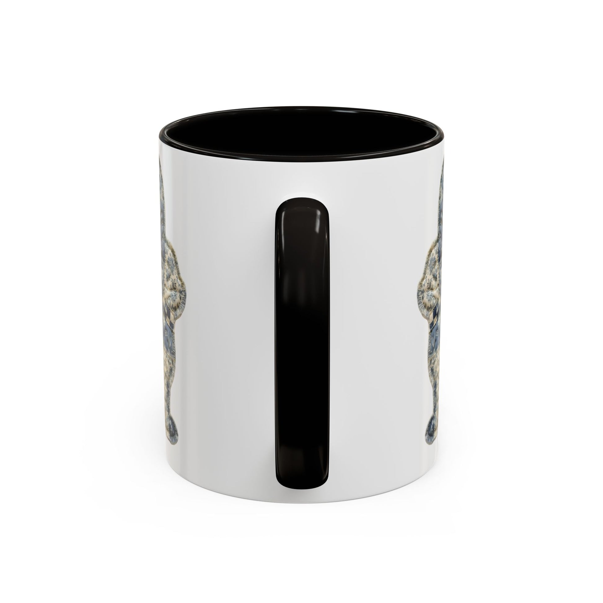 Glossy white ceramic mug with a black handle and interior, featuring a muted blue patchwork bunny illustration.