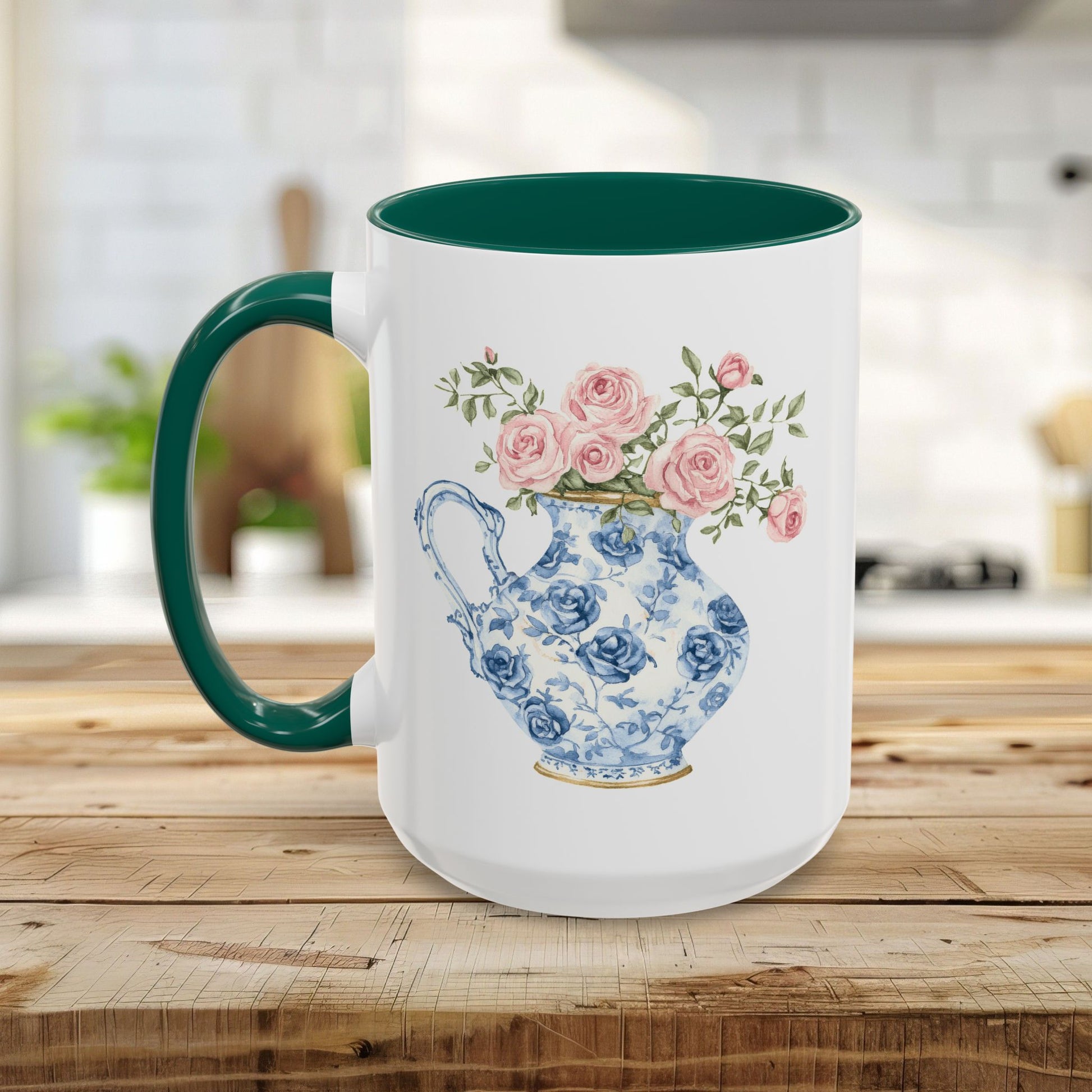 White ceramic mug with green handle and interior, featuring a blue-and-white pitcher with pink roses.