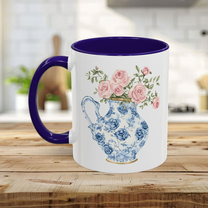 White ceramic mug with a purple handle and interior, featuring a blue-and-white porcelain pitcher with pink roses.
