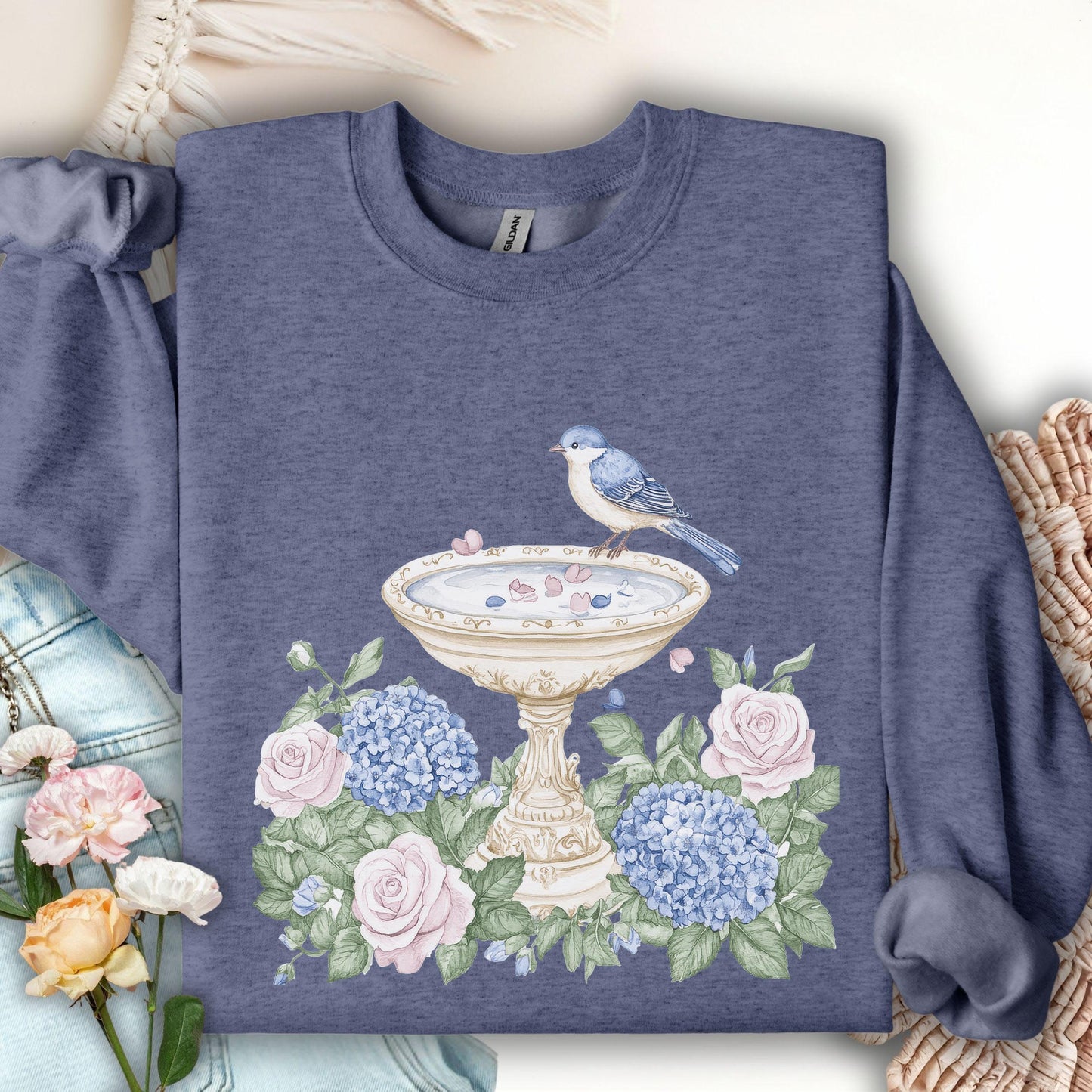 Heather Sport Dark Navy sweatshirt with a watercolor bird bath, blue hydrangeas, and pink roses design.